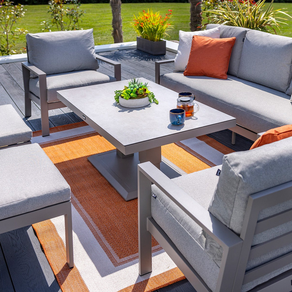 Outdoor patio furniture set with cushions on a wooden deck