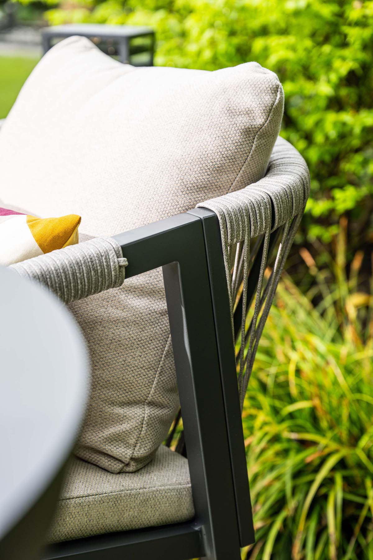 Chair with cushions in a garden setting