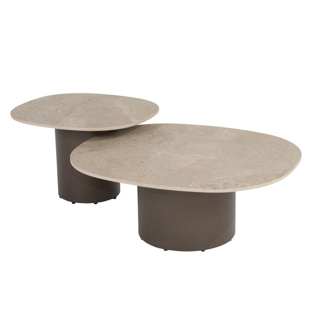 Two round concrete coffee tables on a white background